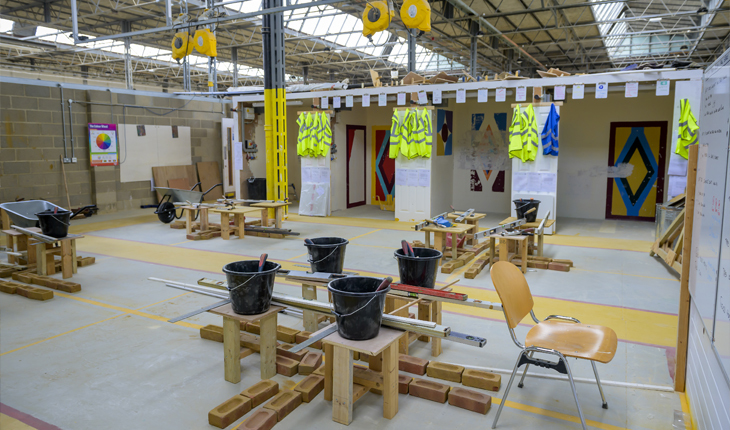 Interior of building with construction students